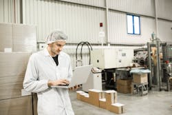 Factory-employee-on-laptop Factory-employee-on-laptop