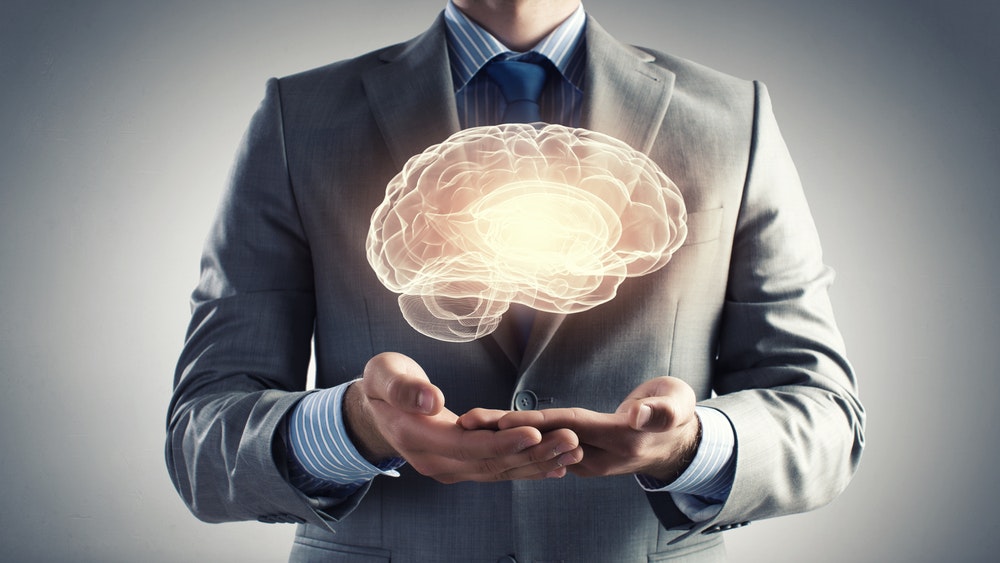 1660601289873 Closeupofbusinessmanholdingdigitalimageofbraininpalm