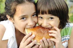 1661880944294 Twokidseatingburger 1661880944294 Twokidseatingburger