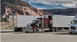 "Semi Truck and Trailers at a Gas Station Entering the Mountains of New Mexico"