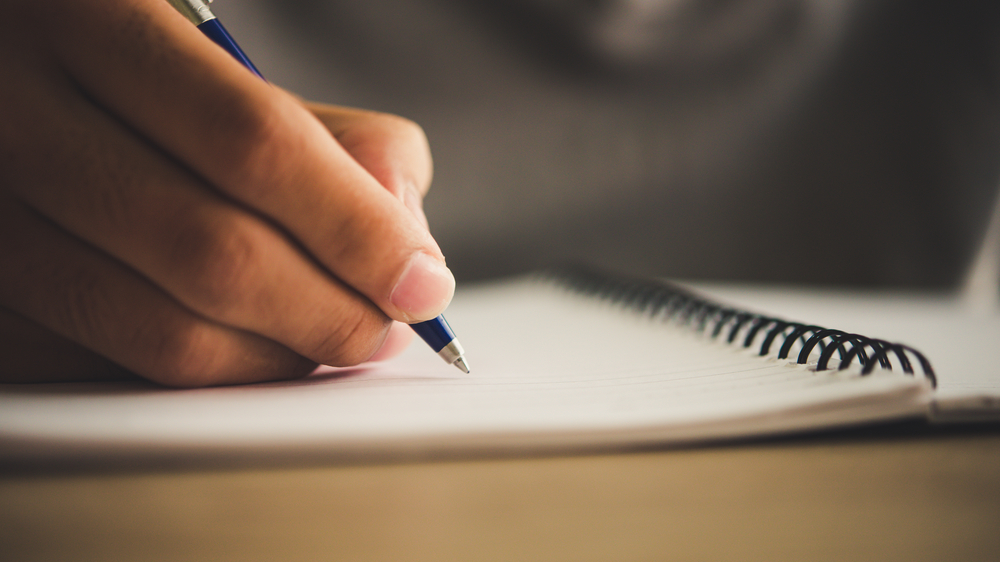 Writing In Notebook 6436d69610ccf