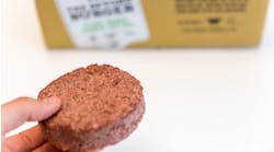 "Hand shows Beyond Meat Patty - a healthy, plant-based alternative of burger meat"
