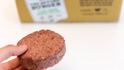 'Hand shows Beyond Meat Patty - a healthy, plant-based alternative of burger meat' 'Hand shows Beyond Meat Patty - a healthy, plant-based alternative of burger meat'