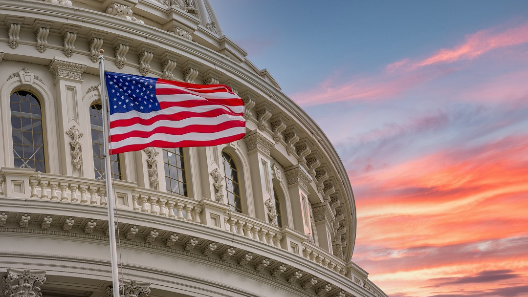us capitol american flag sunset