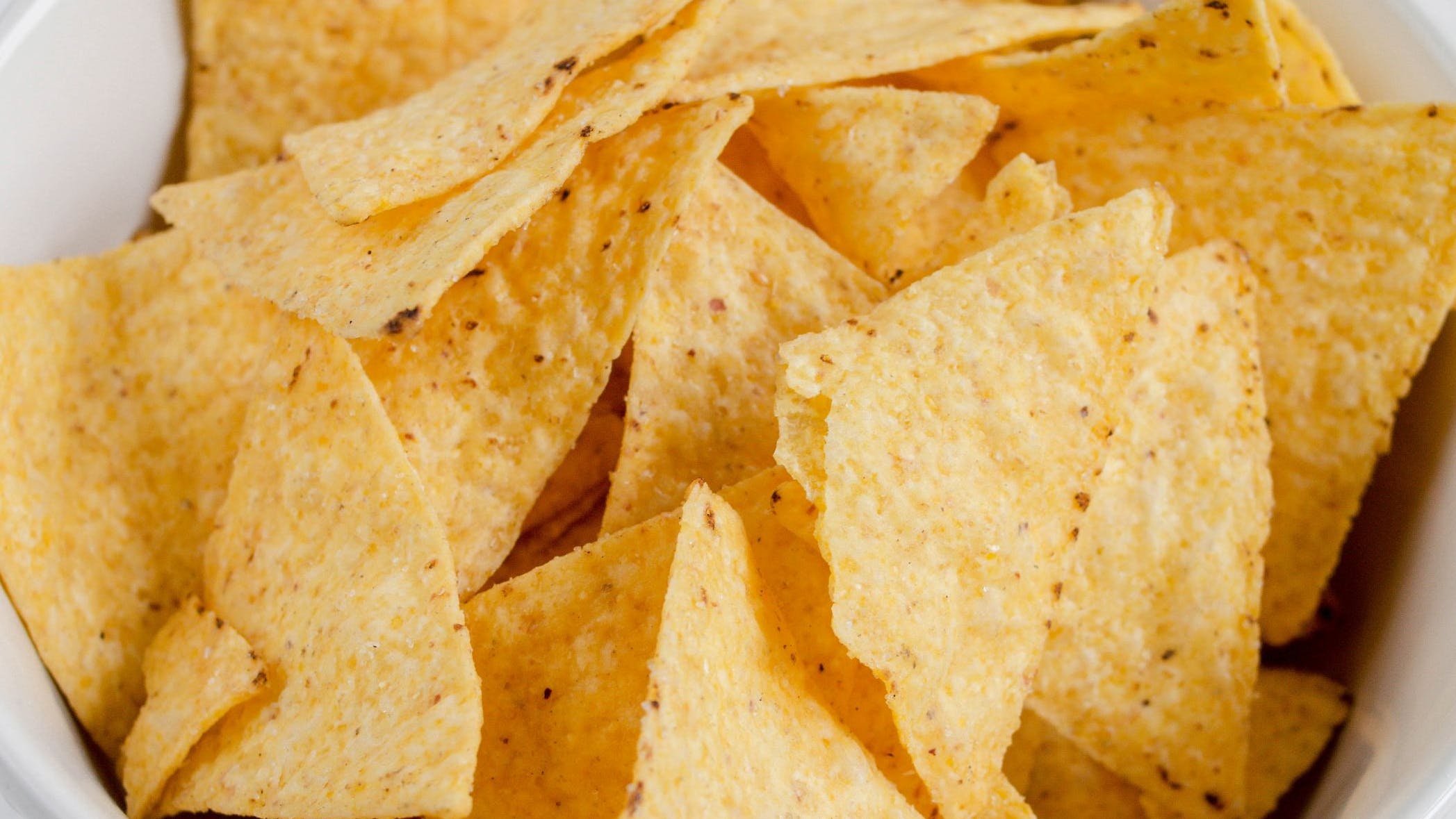 'The tortilla chips in bowl'