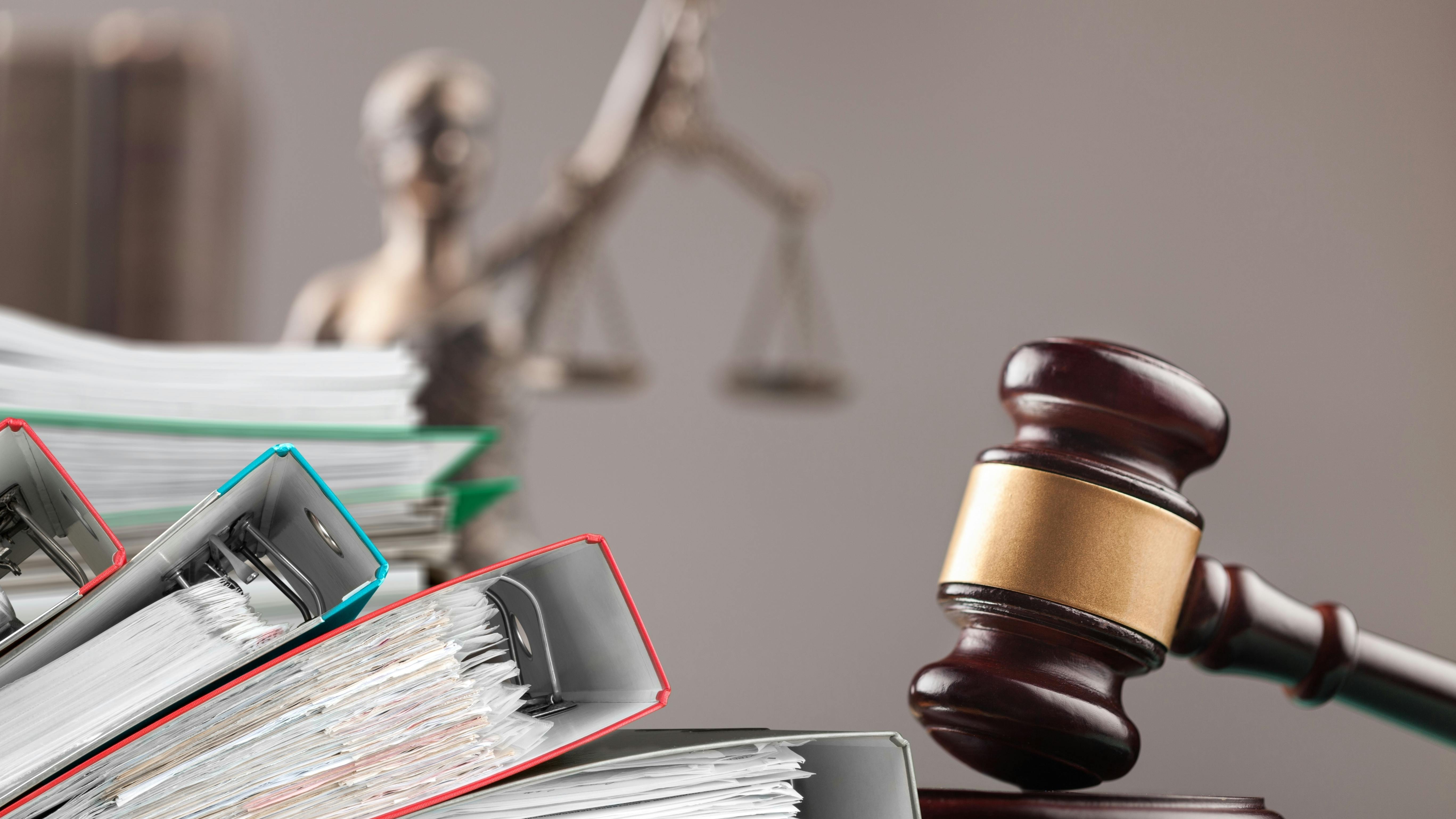 Wooden hammer, files on the judge table