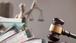 Wooden hammer, files on the judge table Wooden hammer, files on the judge table