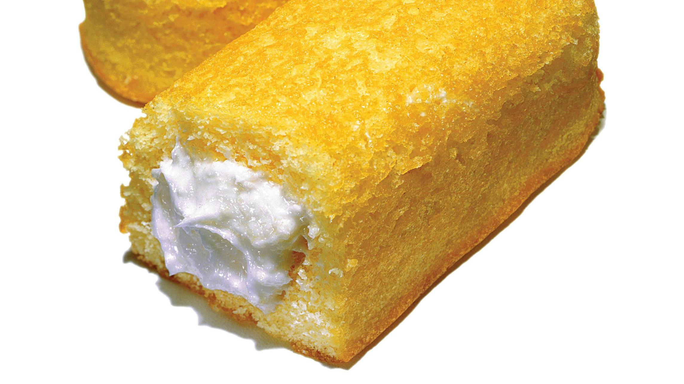 Sponge cake with cream filling on white background