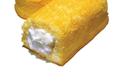 Sponge cake with cream filling on white background Sponge cake with cream filling on white background