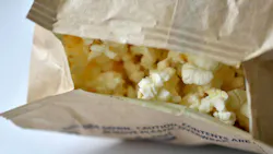 Microwave popcorn on a white background in a bag