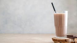 Chocolate protein drink in glass for nutrients and energy Chocolate protein drink in glass for nutrients and energy