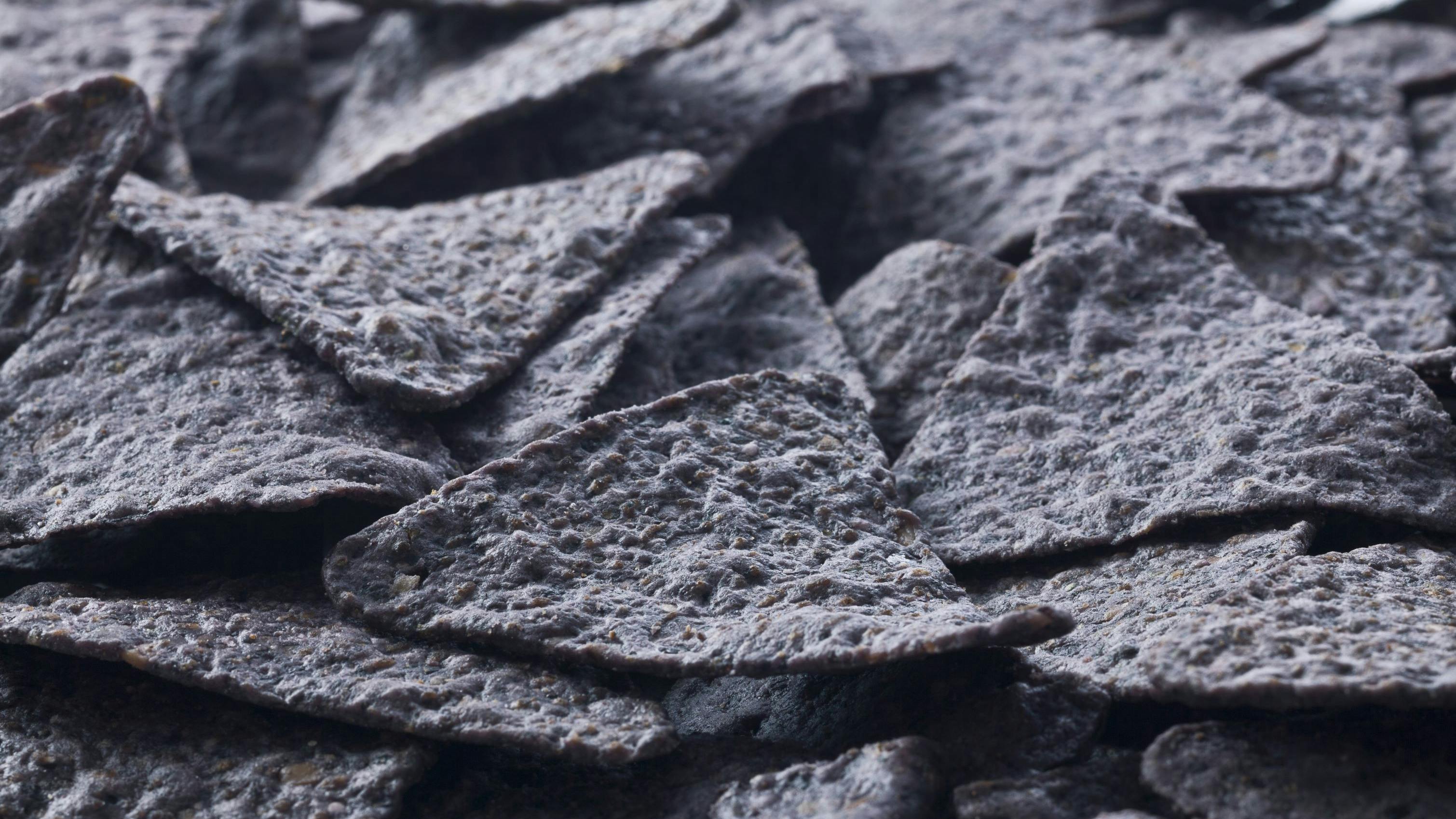 Image of a bunch of crunchy blue tortilla chips