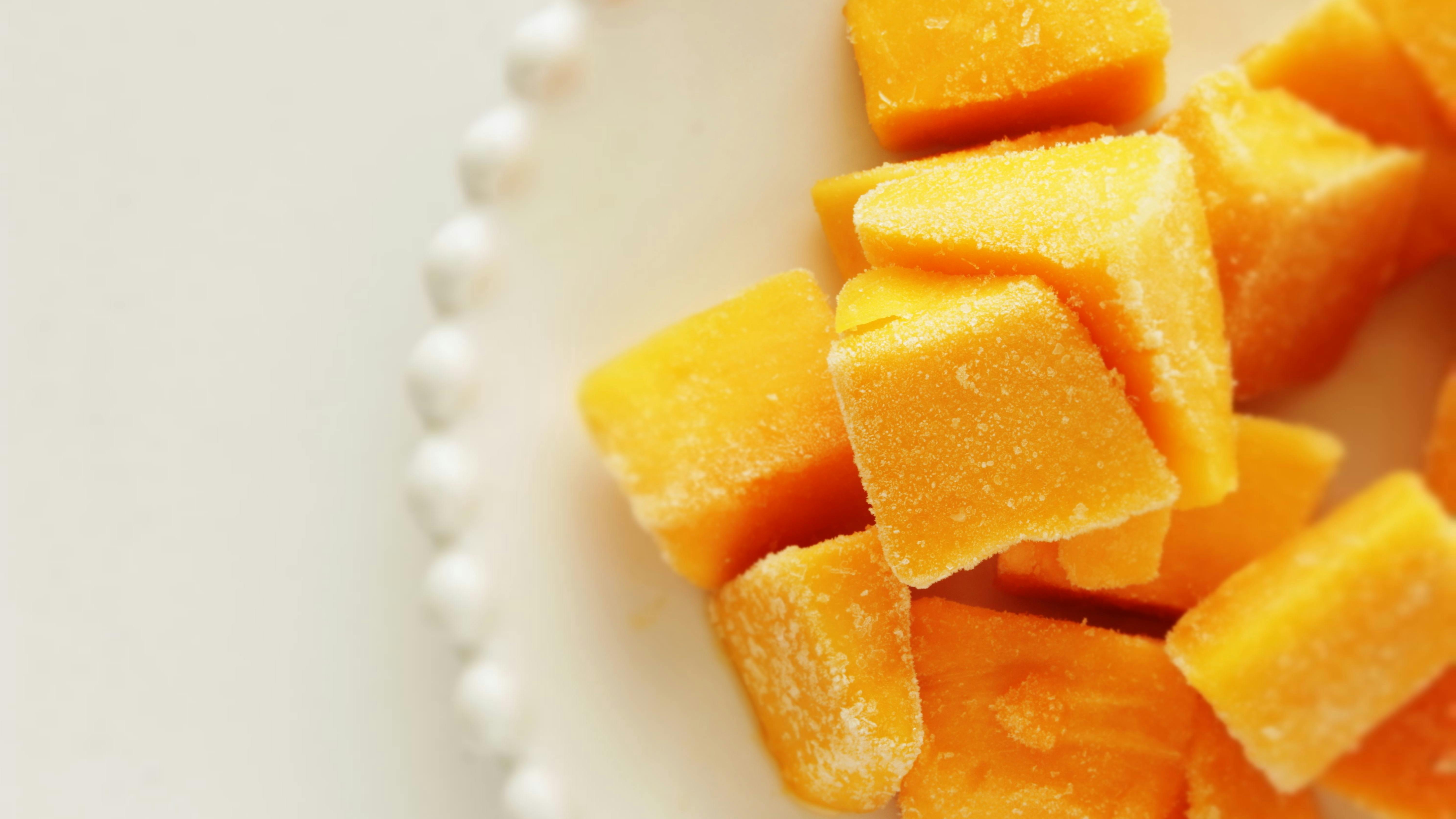 Frozen mango on white dish for stock food