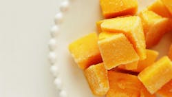 Frozen mango on white dish for stock food Frozen mango on white dish for stock food