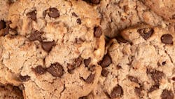 Cookies background. Chocolate chips biscuits texture background. Close up. Cookies background. Chocolate chips biscuits texture background. Close up.
