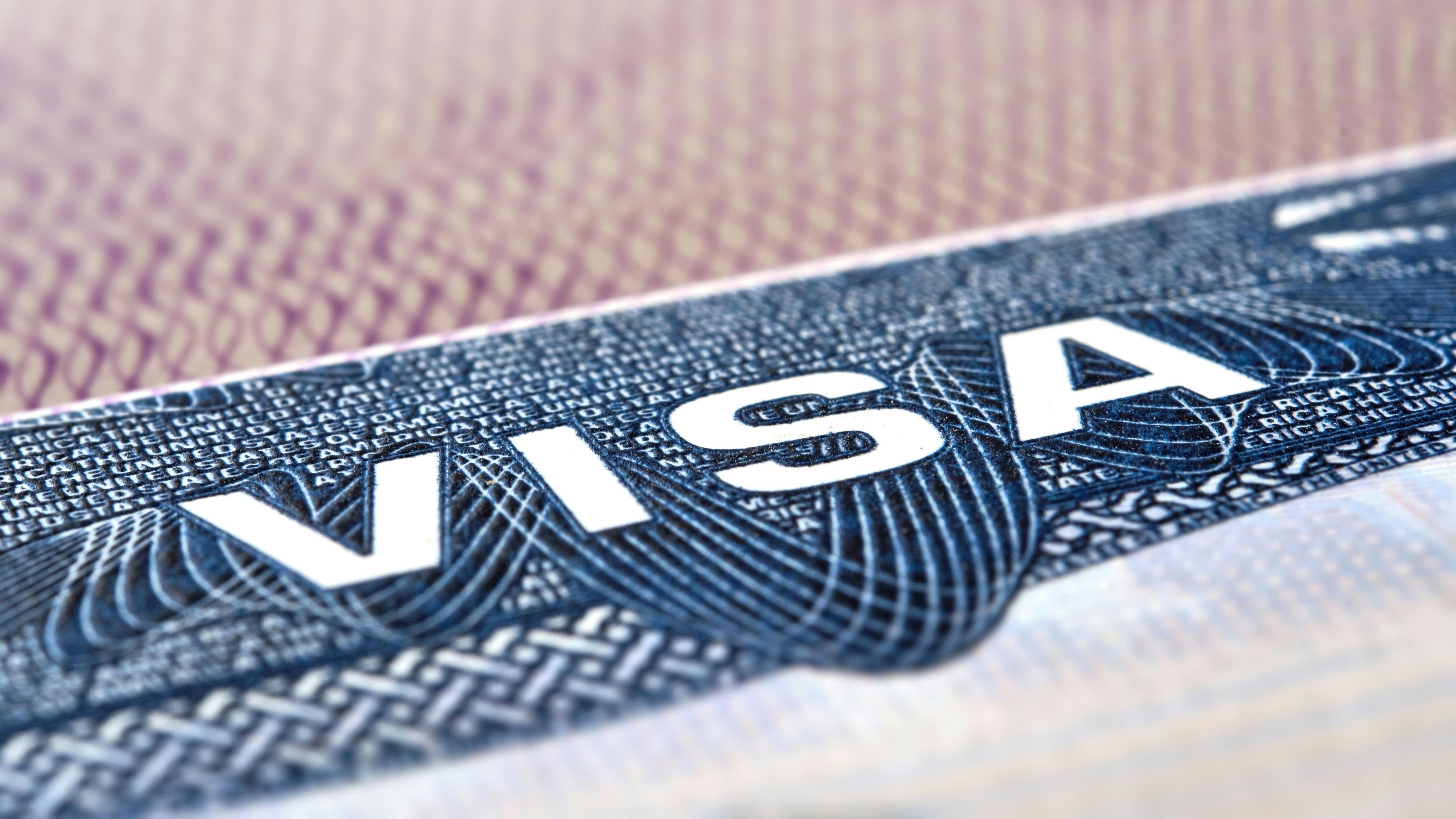 U.S. VISA United States of America. American Tourist or Green Card Visa on passport background.