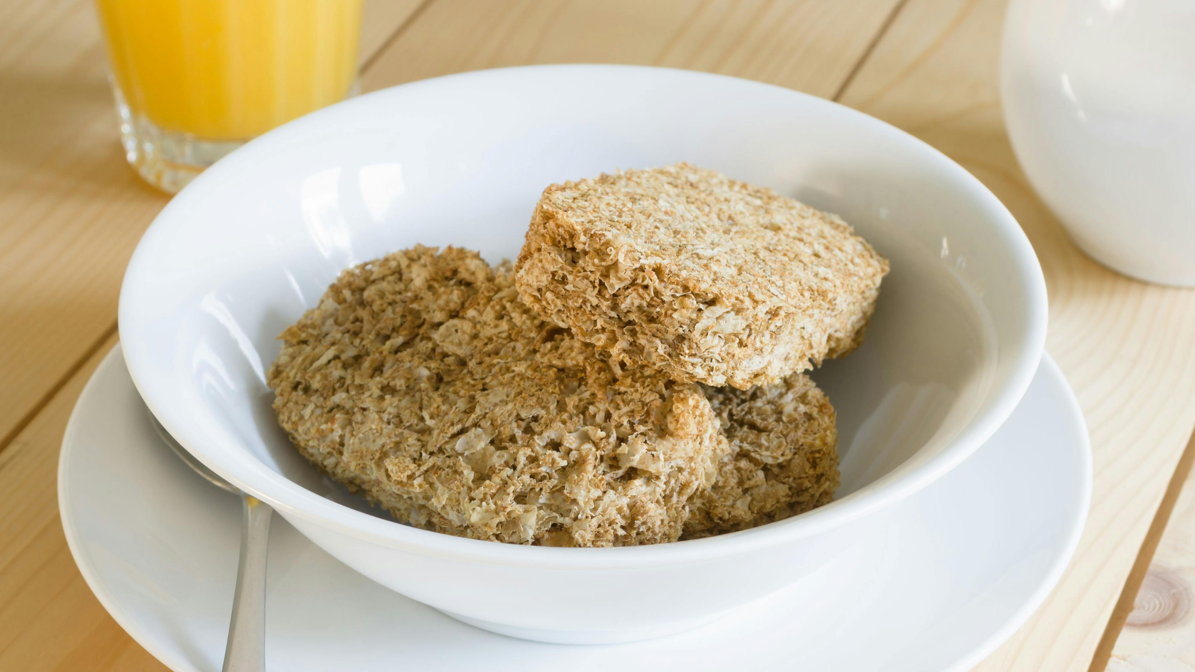 Healthy whole wheat breakfast cereal biscuits with orange juice