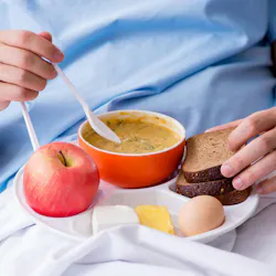 Male patient eating food in the hospital Male patient eating food in the hospital
