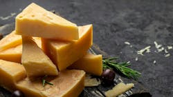 Parmesan cheese on a wooden board Parmesan cheese on a wooden board