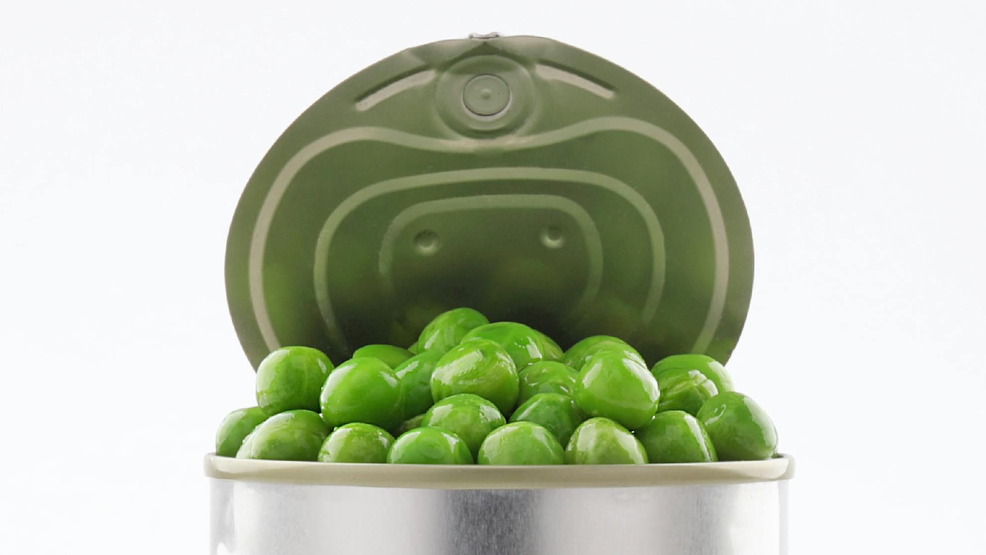 Open tin cans green Peas canned food Aluminum on white background