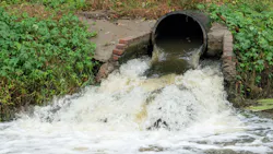 Waste water sewage from a pipe into the river. Water pollution, environment contamination concept Waste water sewage from a pipe into the river. Water pollution, environment contamination concept
