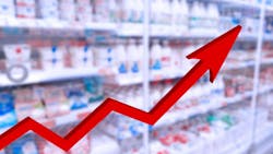 Red grow up large 3d arrow on abstract blur grocery store background. Red grow up large 3d arrow on abstract blur grocery store background.