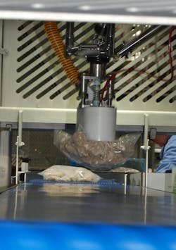 Wayne-Sanderson has installed robotics in the pack-off area of its wing line at the prepared foods plant in Decatur, moving employees out of repetitive motion jobs like this into better roles. Wayne-Sanderson has installed robotics in the pack-off area of its wing line at the prepared foods plant in Decatur, moving employees out of repetitive motion jobs like this into better roles.