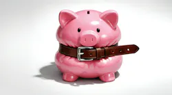 Pink piggy bank squeezed with a belt around the middle Pink piggy bank squeezed with a belt around the middle
