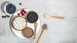 bowls and spoons filled with fiber superfoods