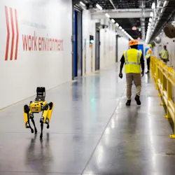 Purina employees and robot dog, Spot, at the grand opening